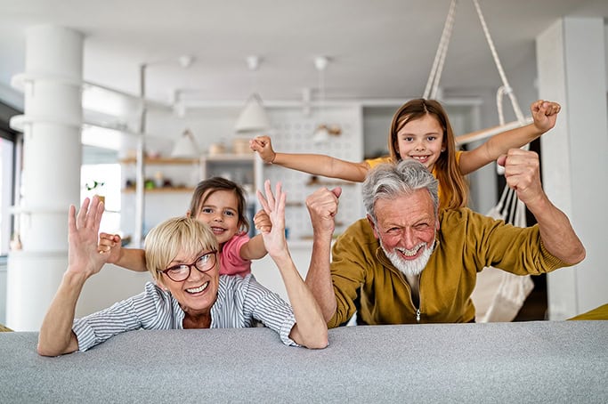 Happy family enjoying quality time together at home, smiling and celebrating.