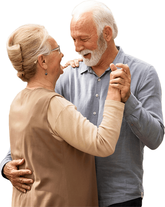 Elderly couple dancing together, showcasing joy and companionship.