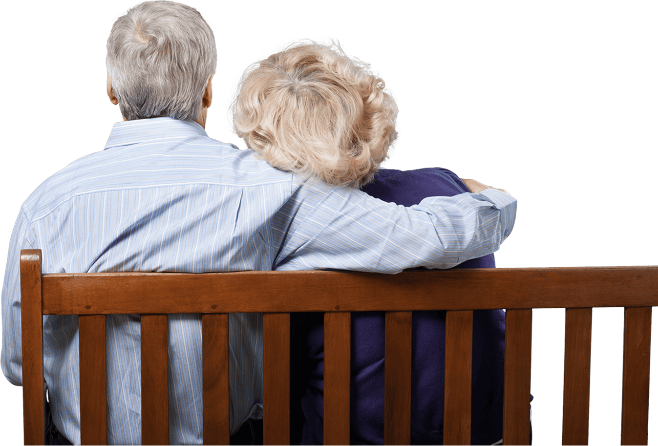 Older couple sitting on a park bench.