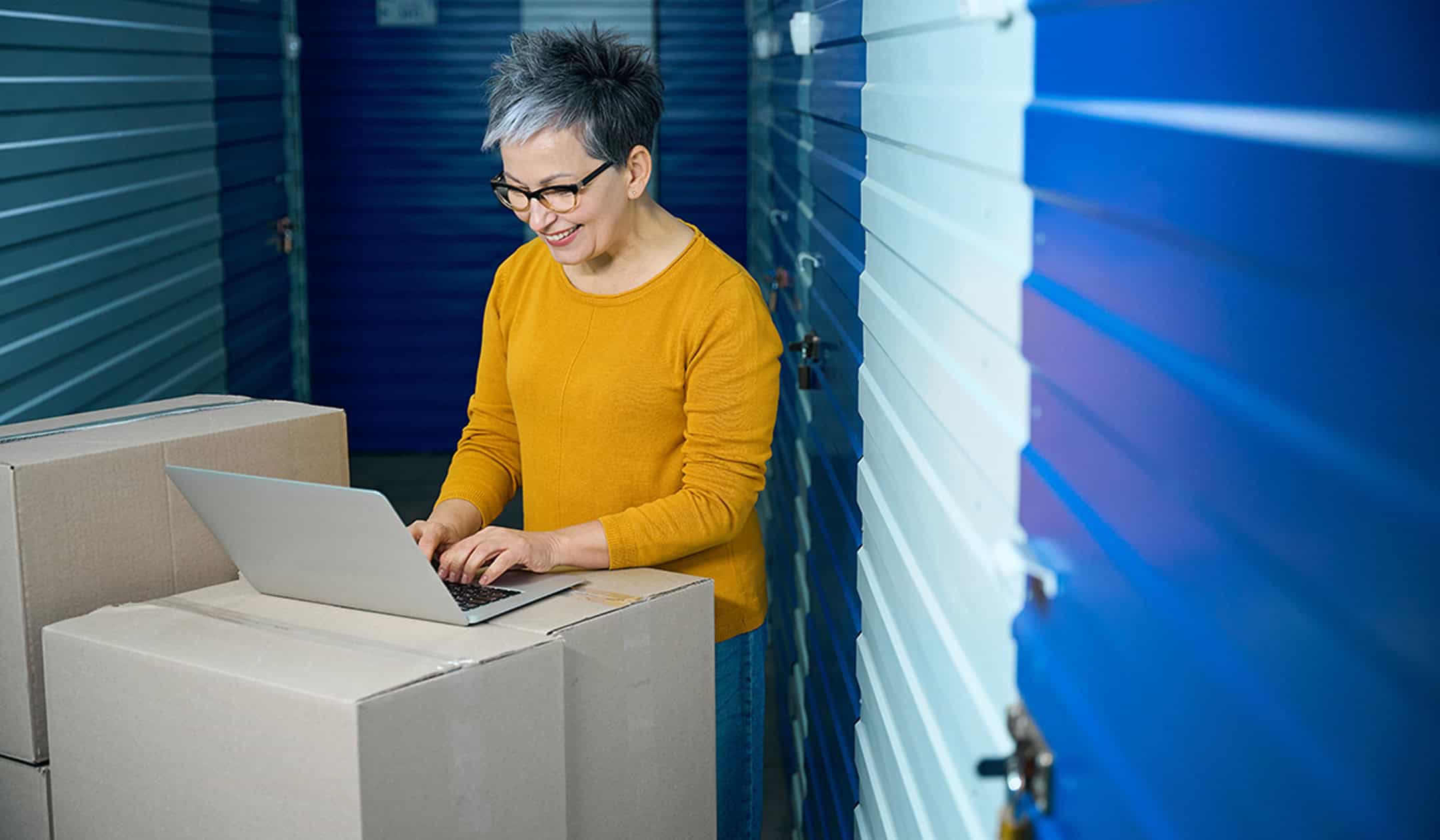 Woman using laptop for property appraisal or valuation.